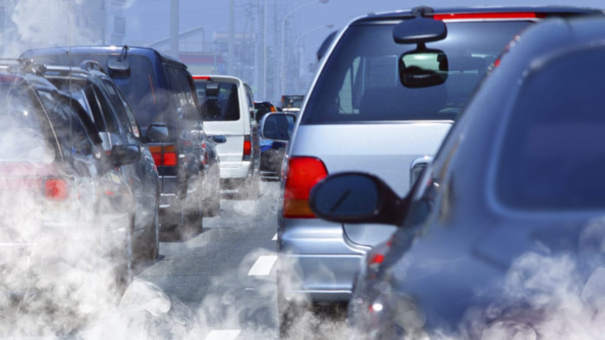 Cars spew visible particles into the air in the form of exhaust