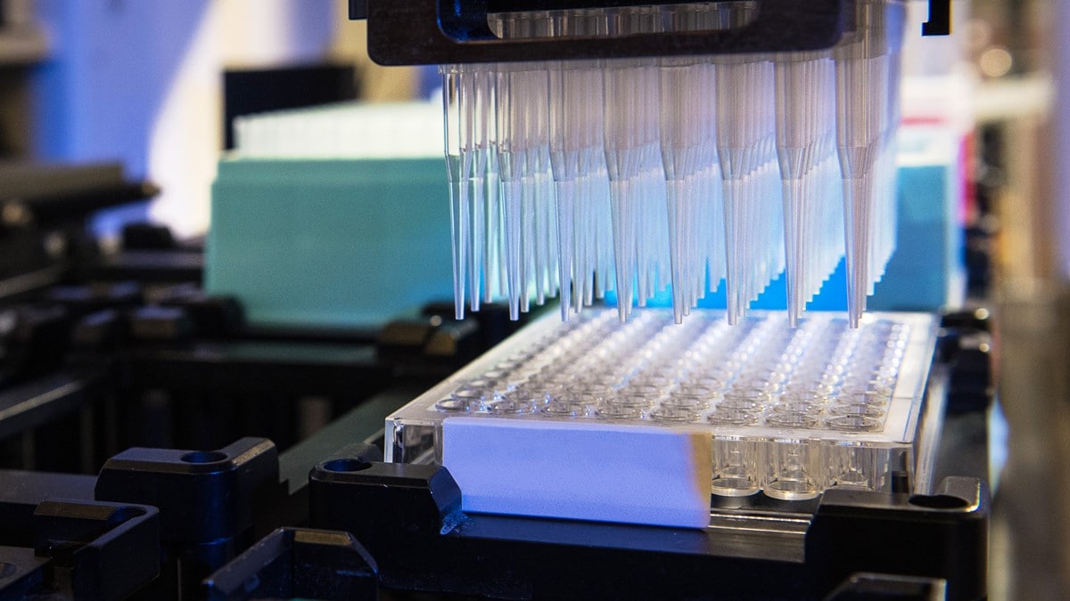 Testing serological specimens at a laboratory using a machine.