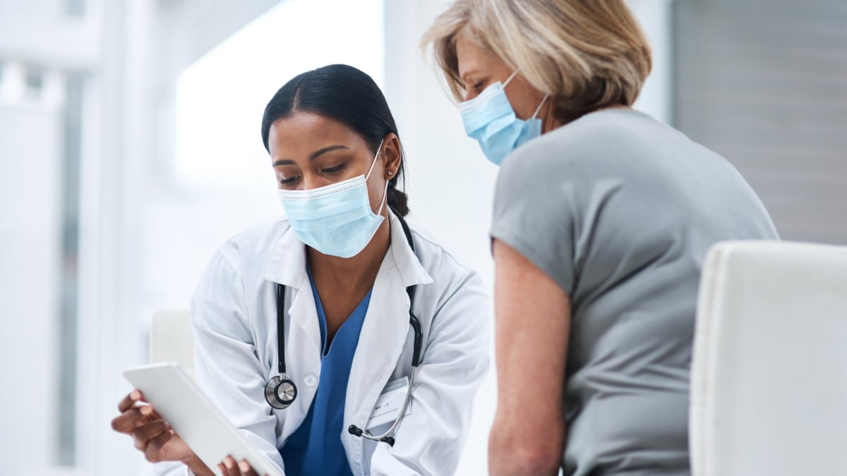 Healthcare provider and patient discussing care.