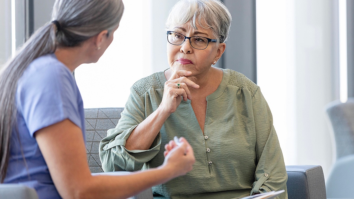 Female doctor explains recommendations to concerned female patient