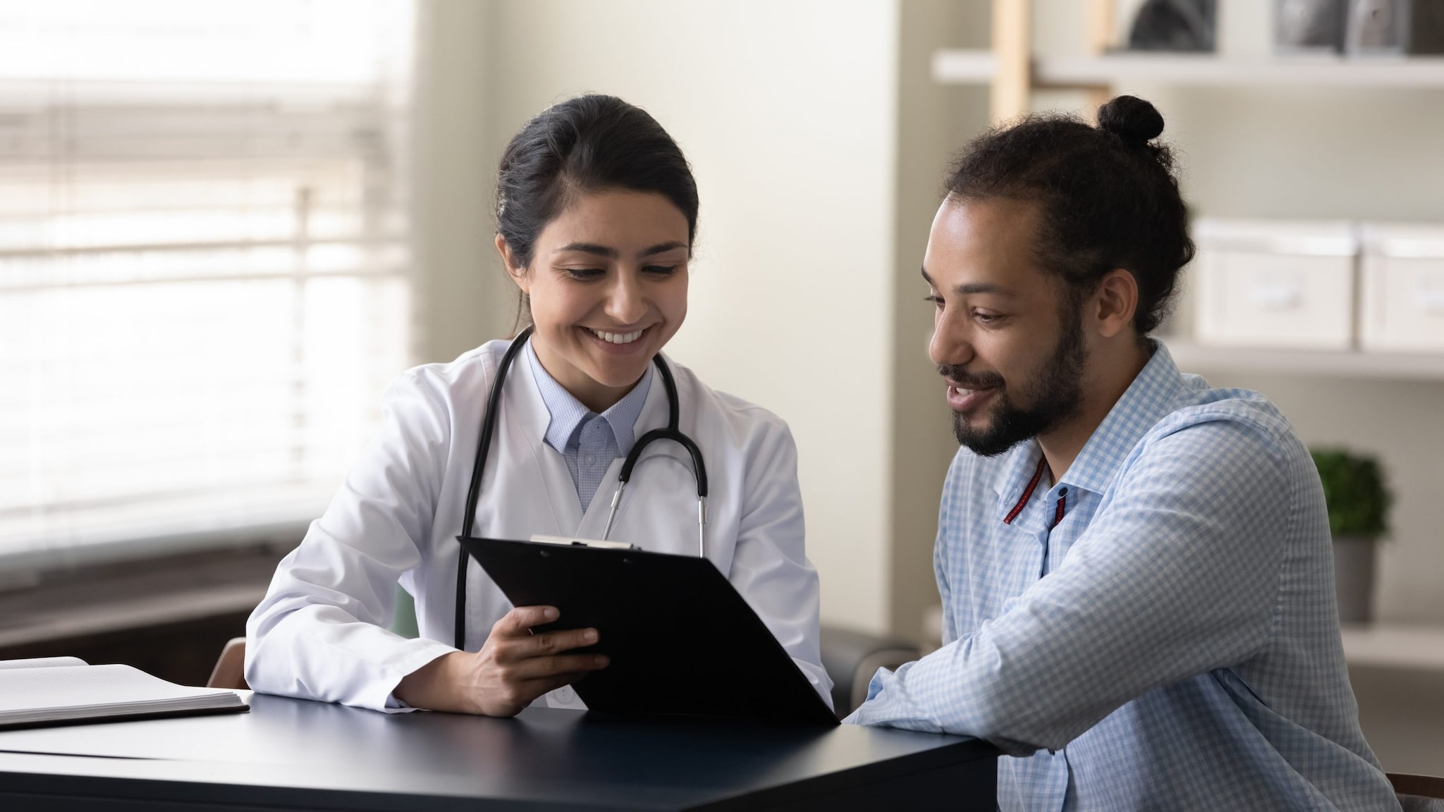 Female doctor explaining asthma triggers to patient