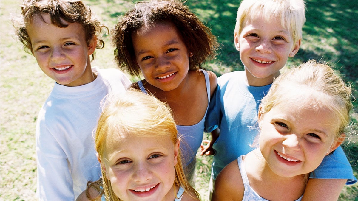 children smiling at the park