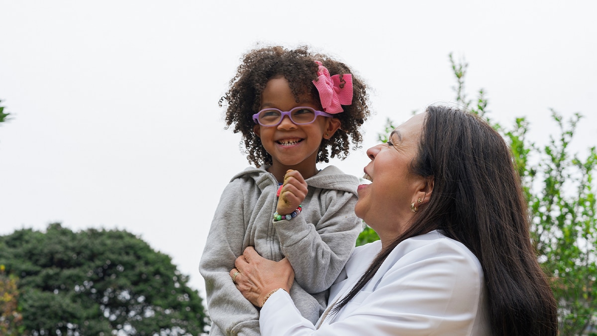 Physiotherapist pediatrician doctor doing exercises with her patient