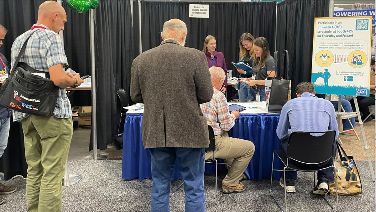 AABP conference attendees filling out survey.