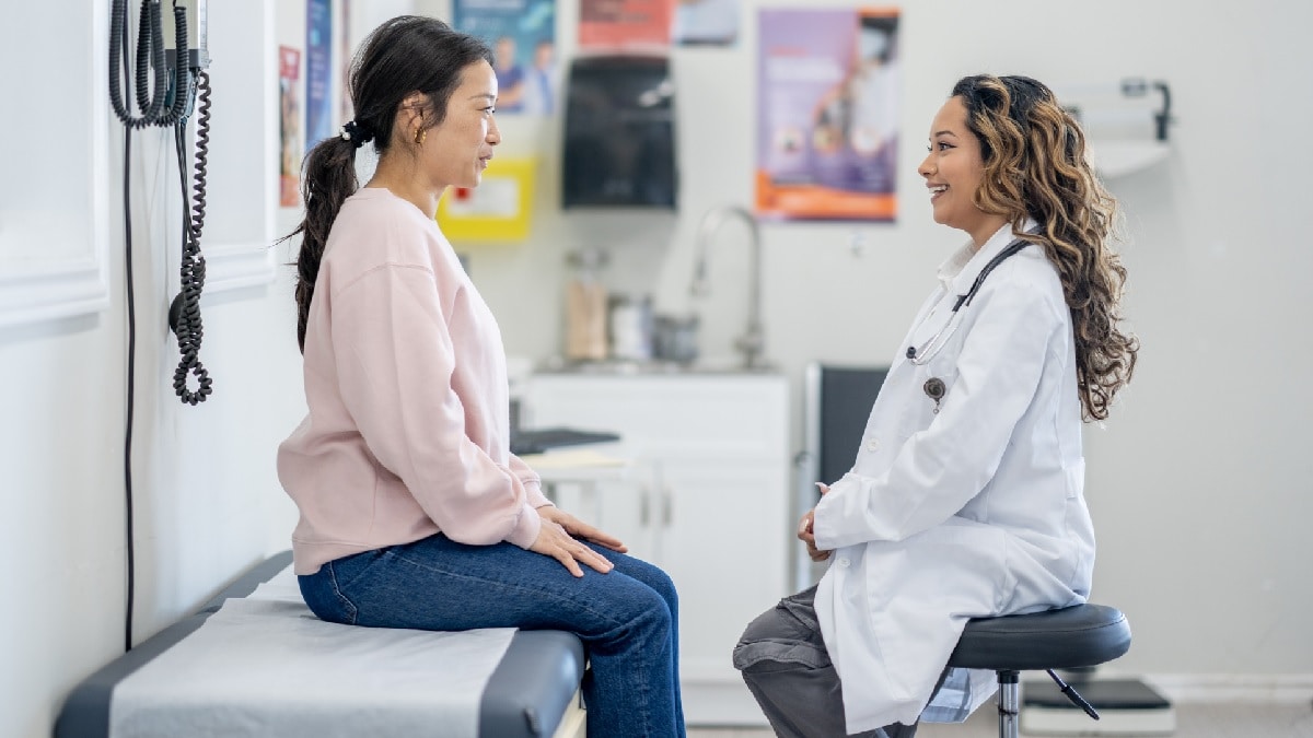 A patient talks to her doctor