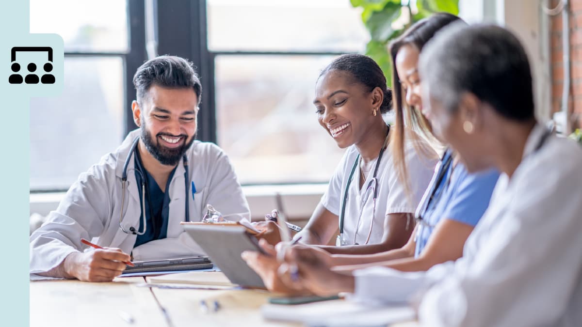 Two doctors and two nurses in a meeting