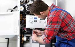 Technician servicing furnace