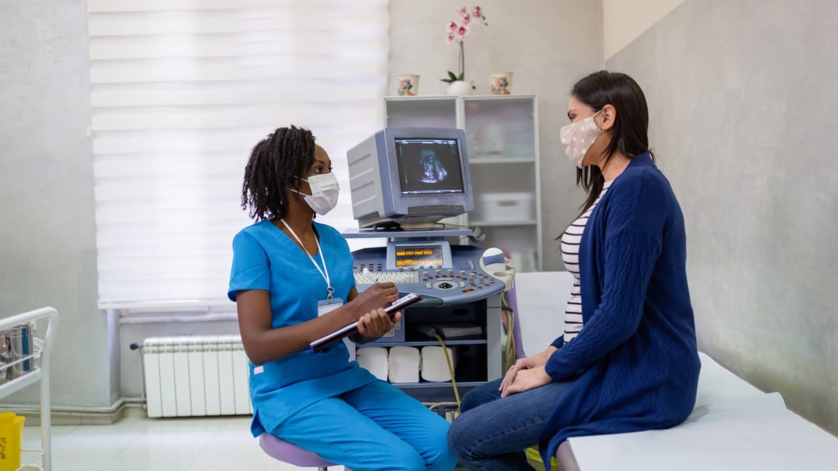 a woman talking to her doctor