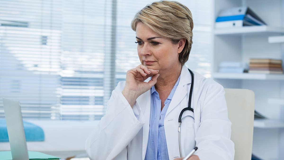 Doctor looking at her laptop