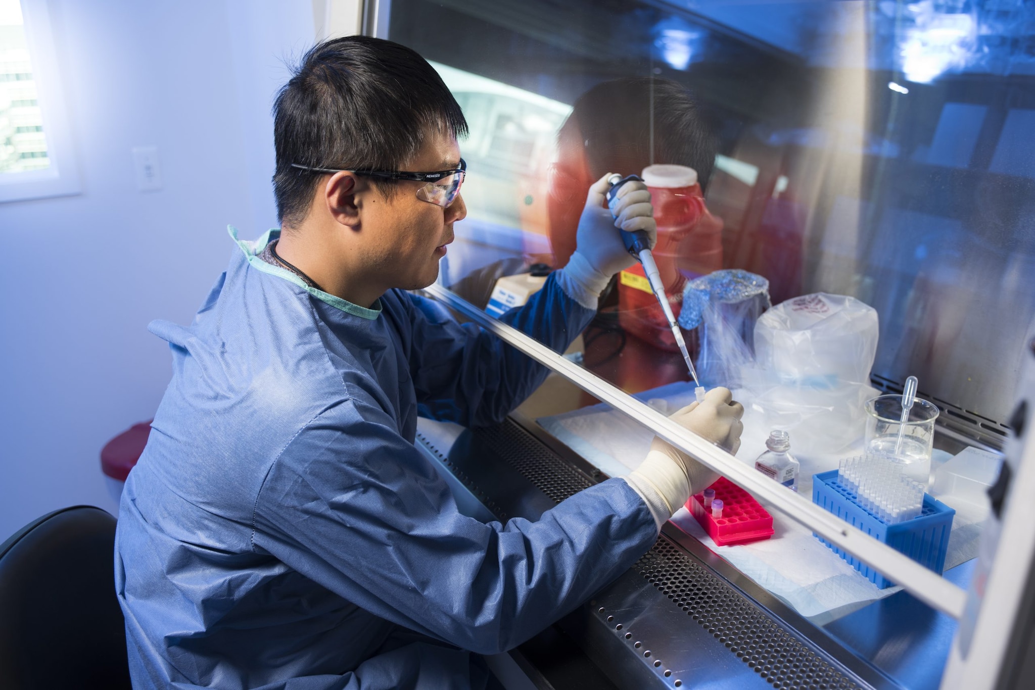 A lab scientist testing a sample.