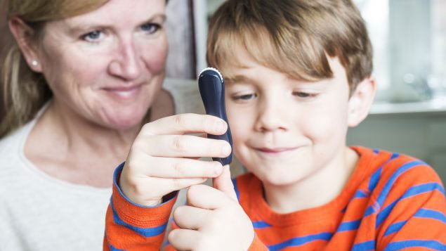 Juvenile diabetes patient with his mother