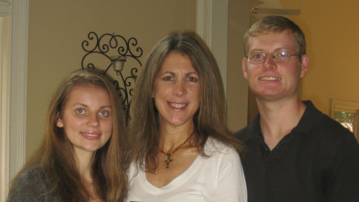 Image of Sasha with his mom and sister