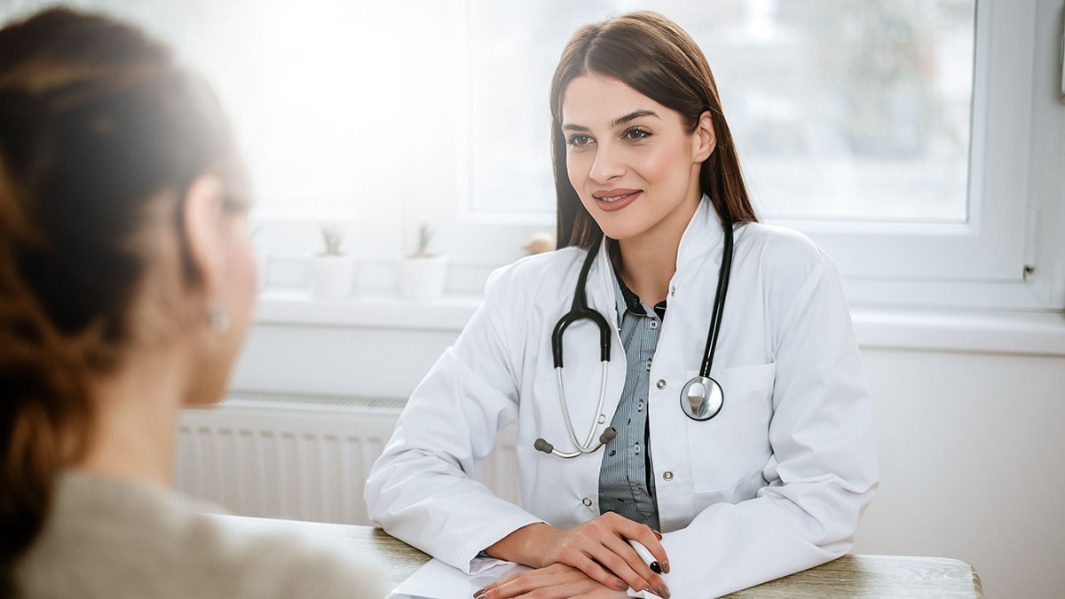 Focused view of a healthcare provider facing a patient.