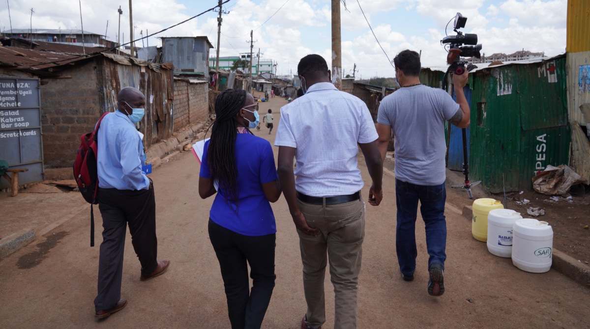 Group of workers walking outside in Kenya.