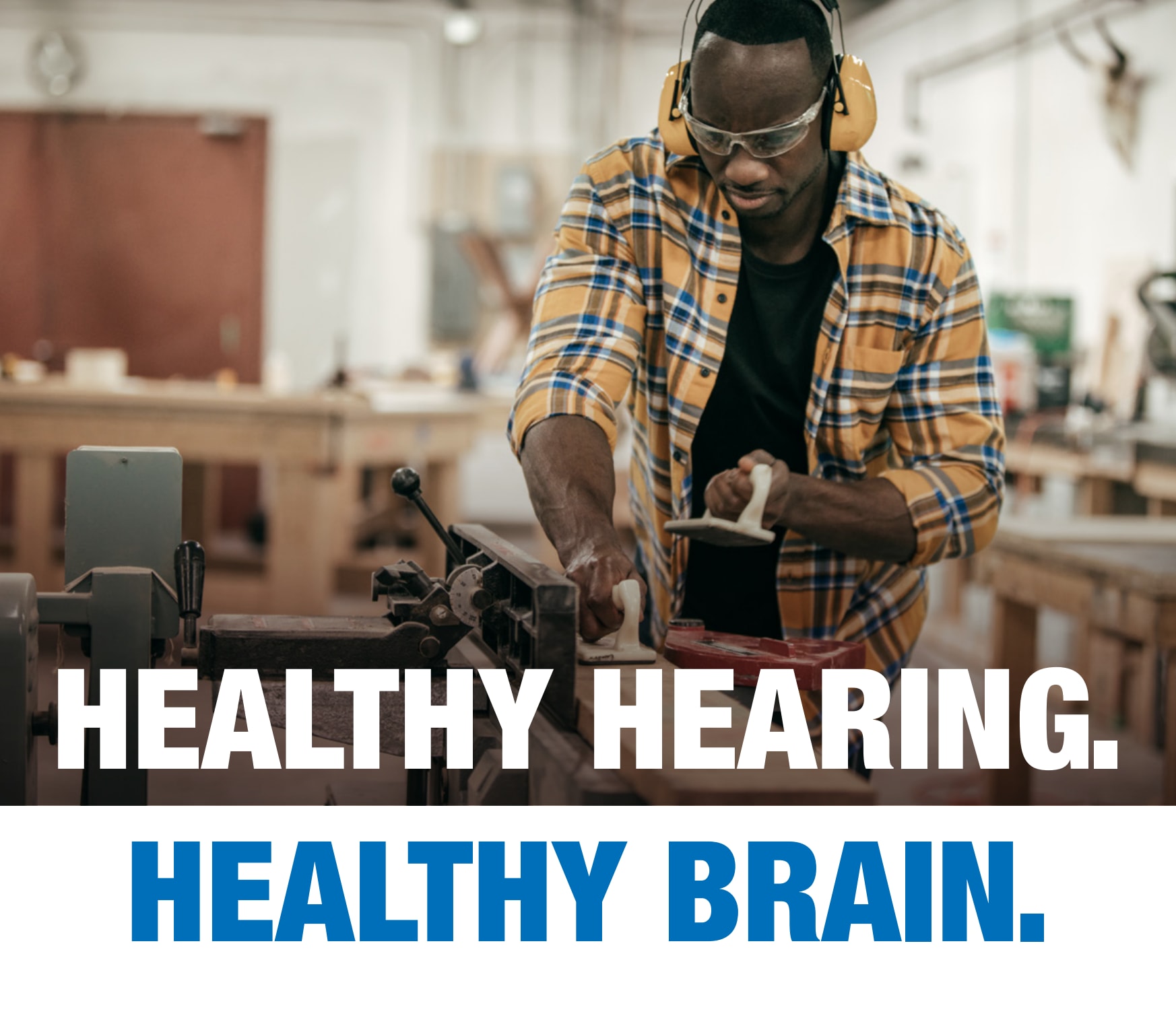 African-American man woodworking in a shop. Text: Healthy Hearing. Healthy Brain.