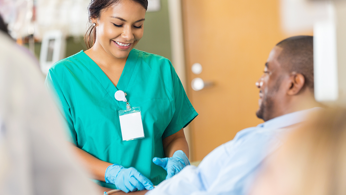 A healthcare professional prepping a patient for medical testing