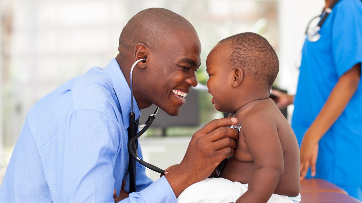 Doctor examining baby