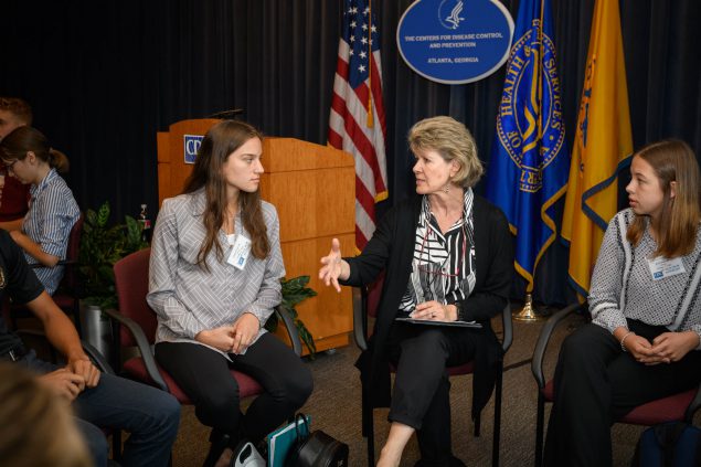 Adult speaking to a student