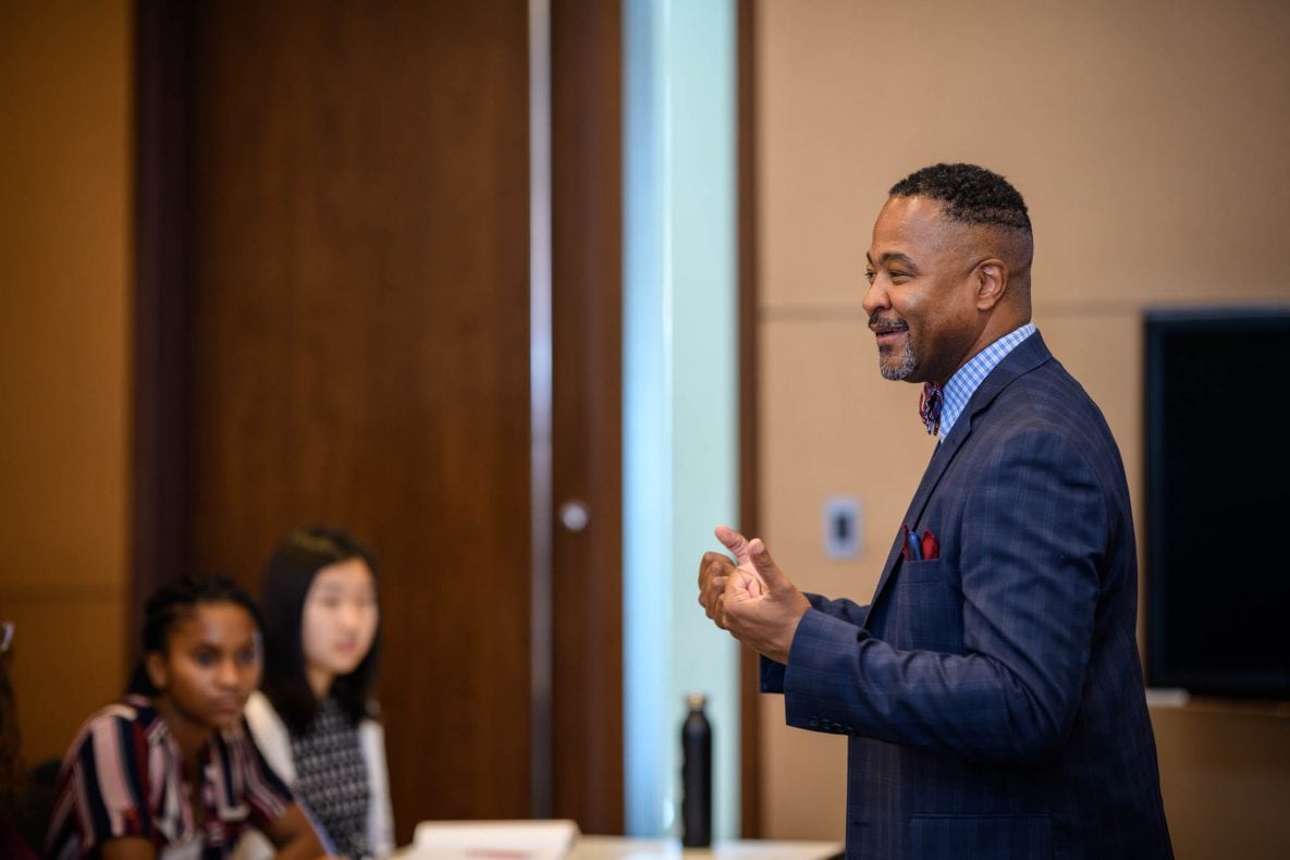 Images of adult male speaking to students