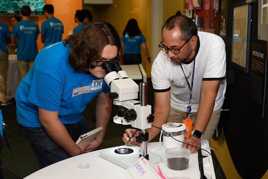 Student using laboratory equipment.