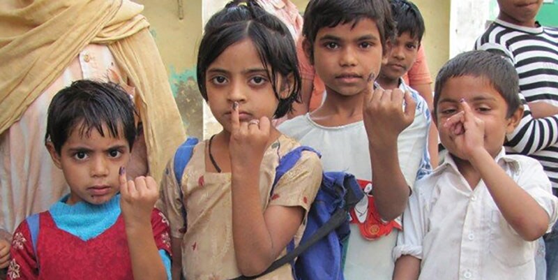 children holding up hands