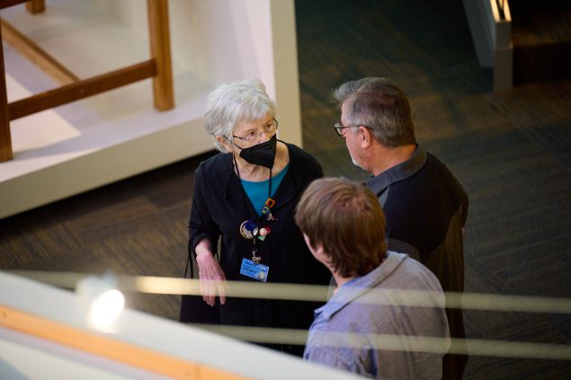 Visitors listening to a Museum docent