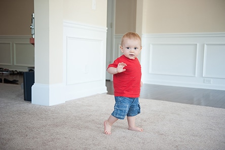 15 month old baby walking and waving