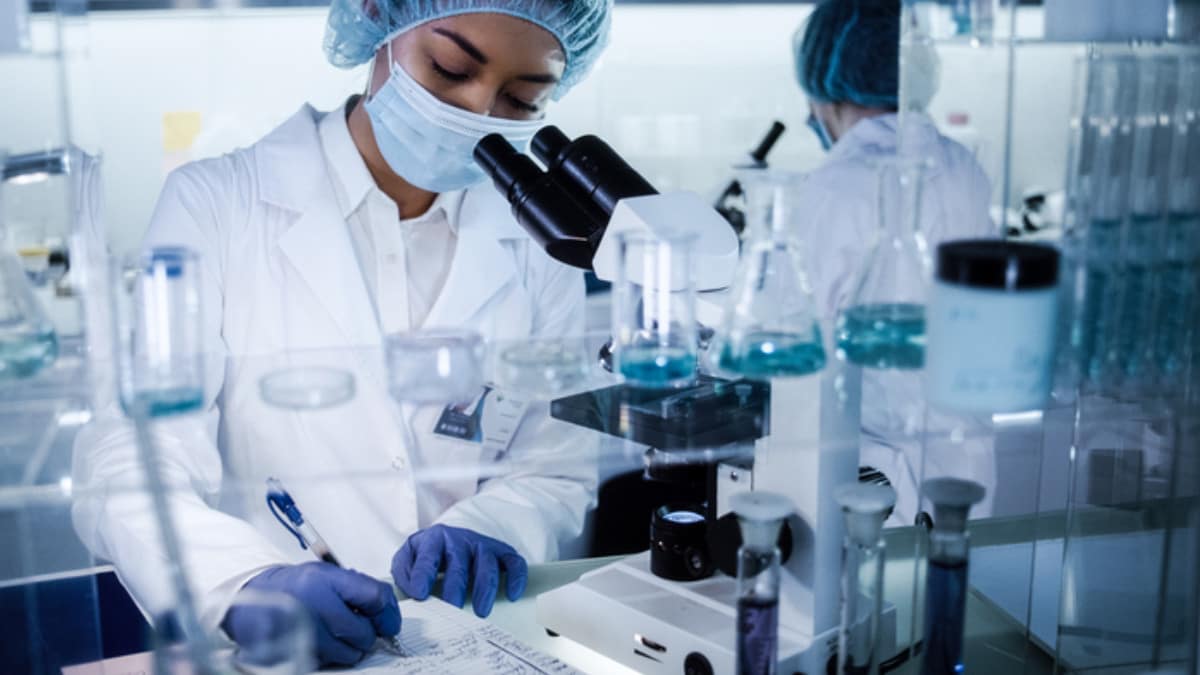 A scientist completing paperwork in a laboratory setting