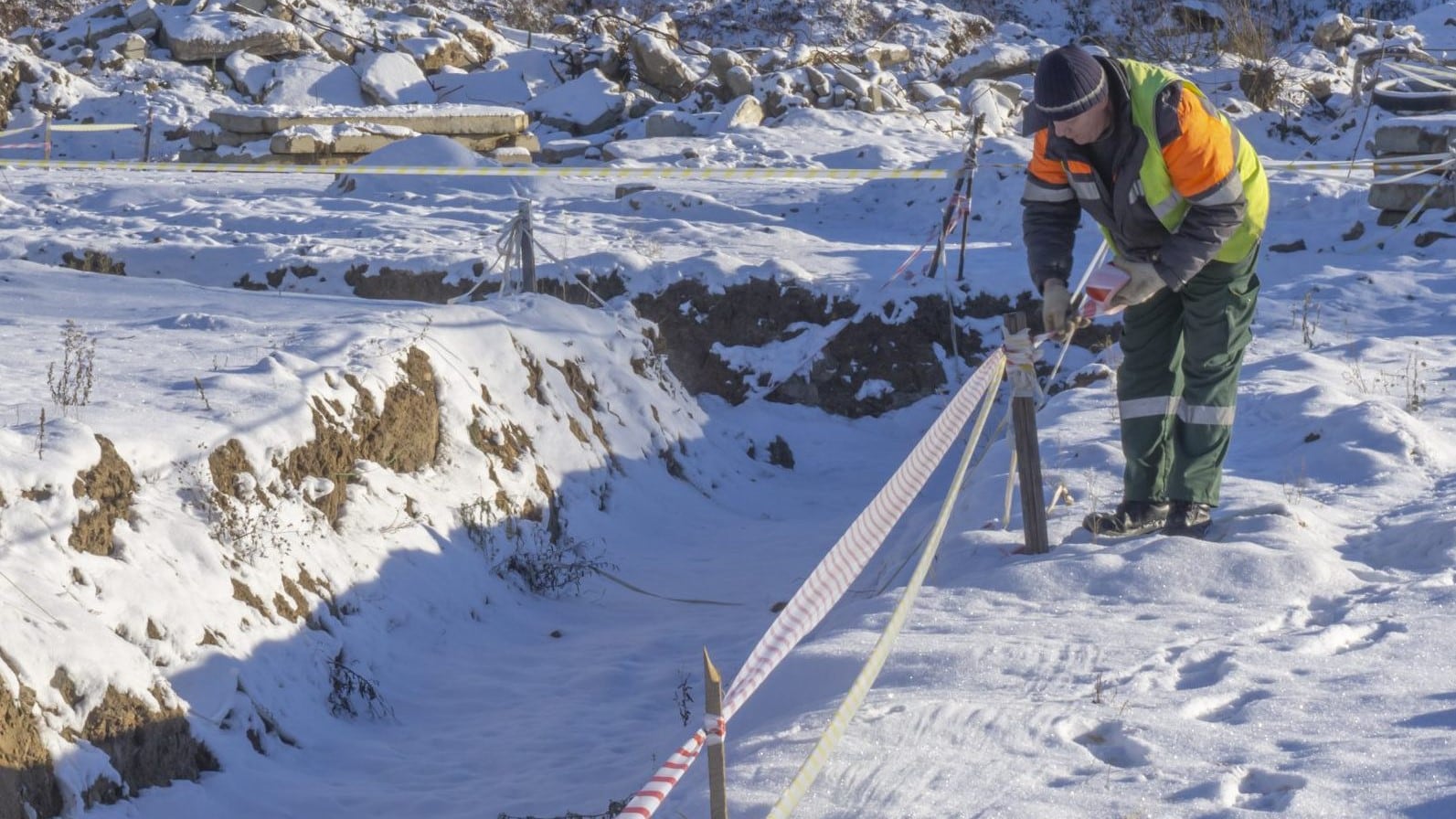 An outdoor worker in the snow