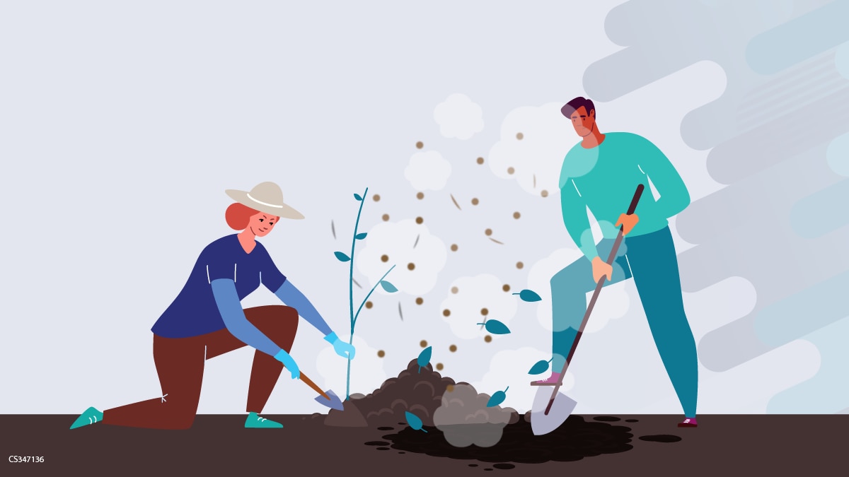 A man and woman digging and doing farm work with dust from the soil in the air