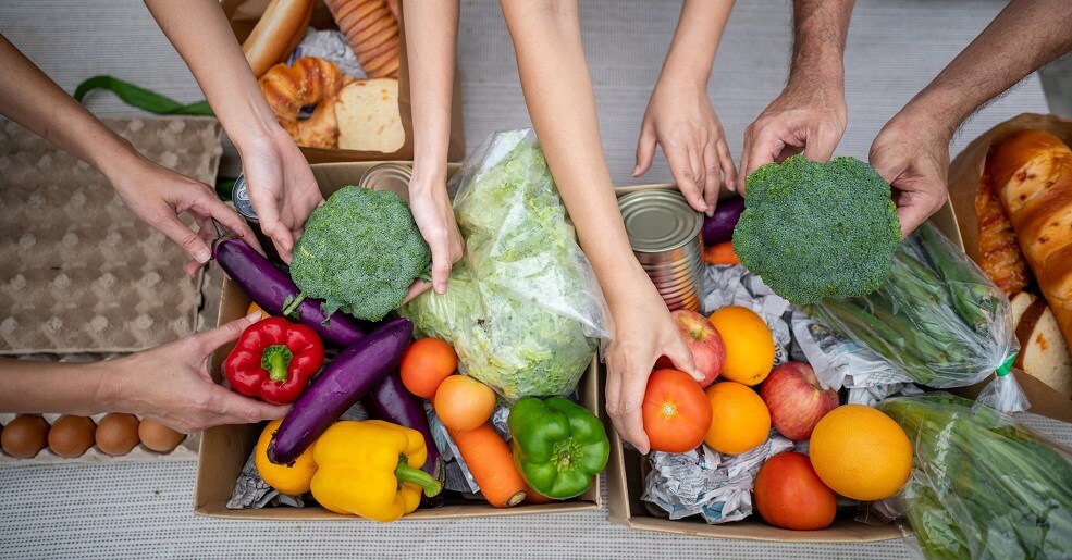 Food loaded by hands of volunteers