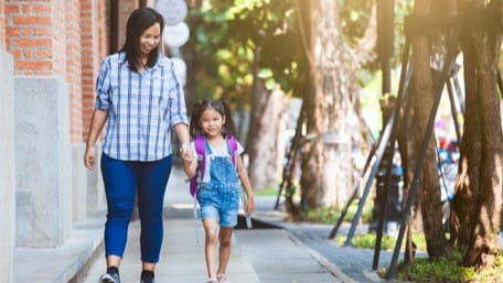 Mother and daughter walking.