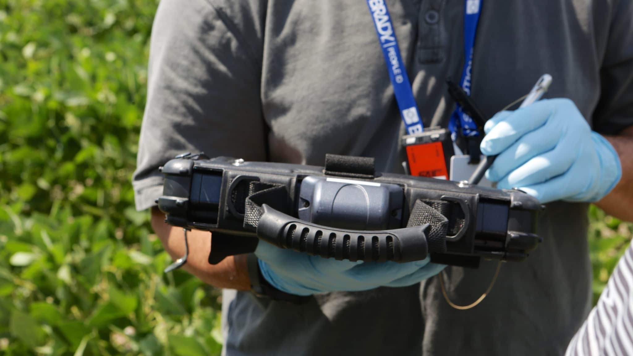 Environmental health specialist using an electronic table in the field.