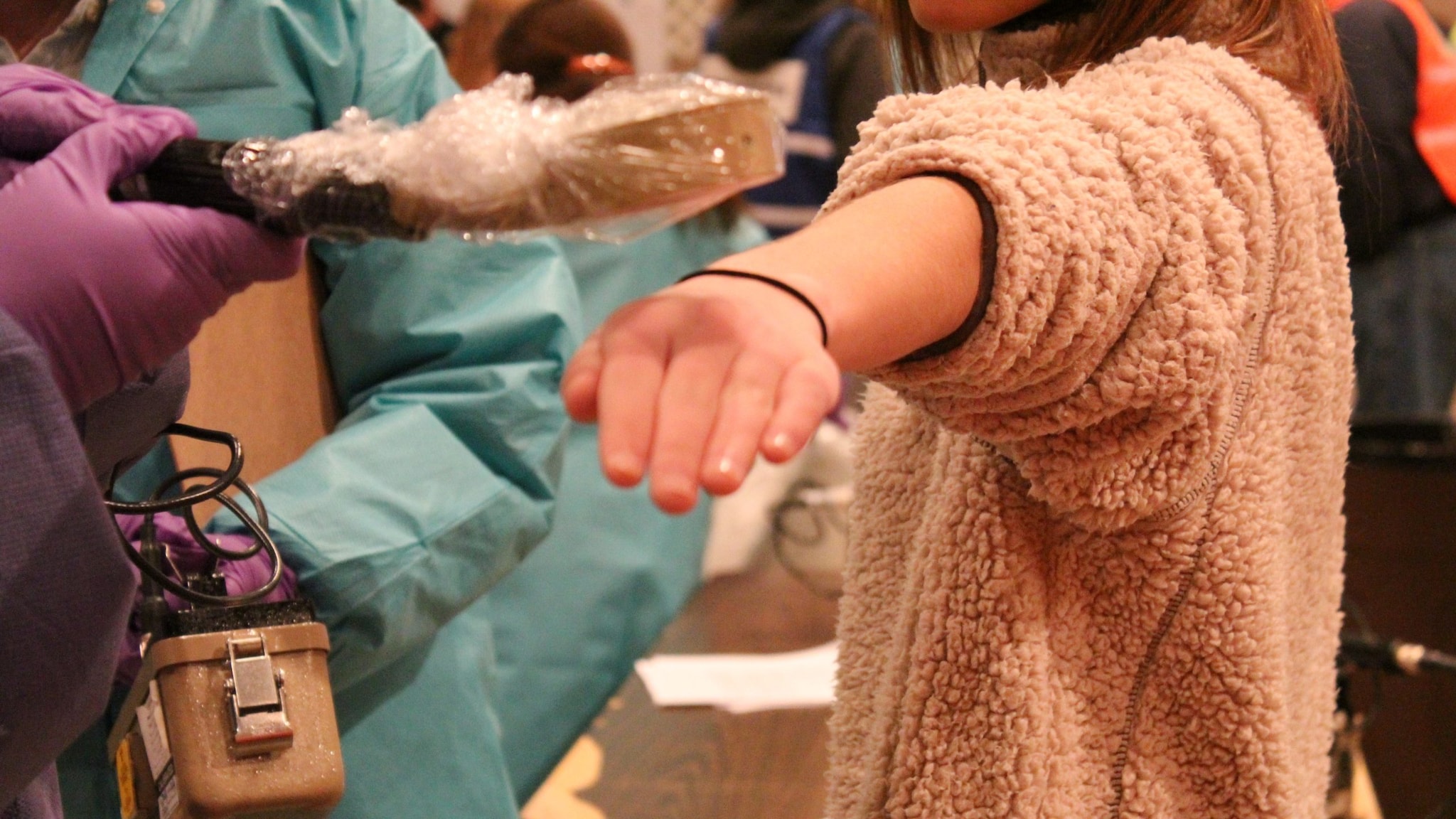 Woman being checked for external radiation contamination.