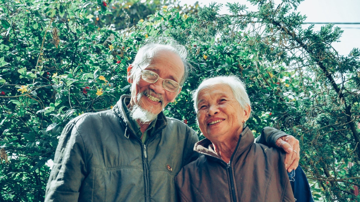 An older man with his arm around an older woman.