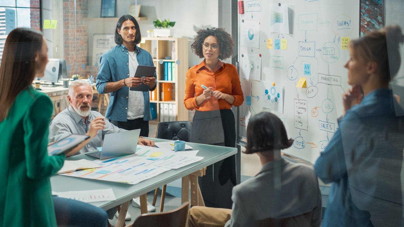 Group of people working together in an office.