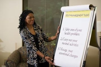 A woman looks over her chart.