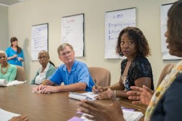 People at a board meeting.