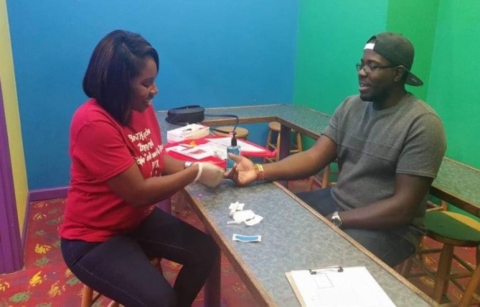 Lametra administering a blood test