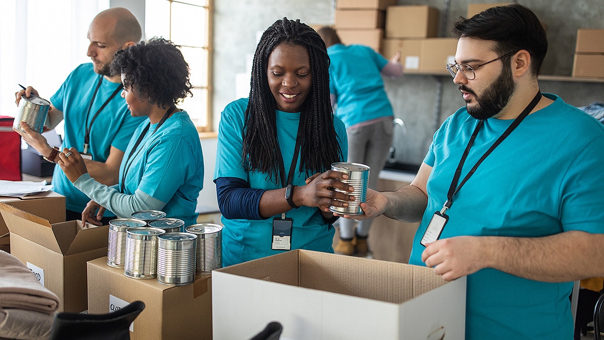 Team of volunteers working together for their community at food bank.