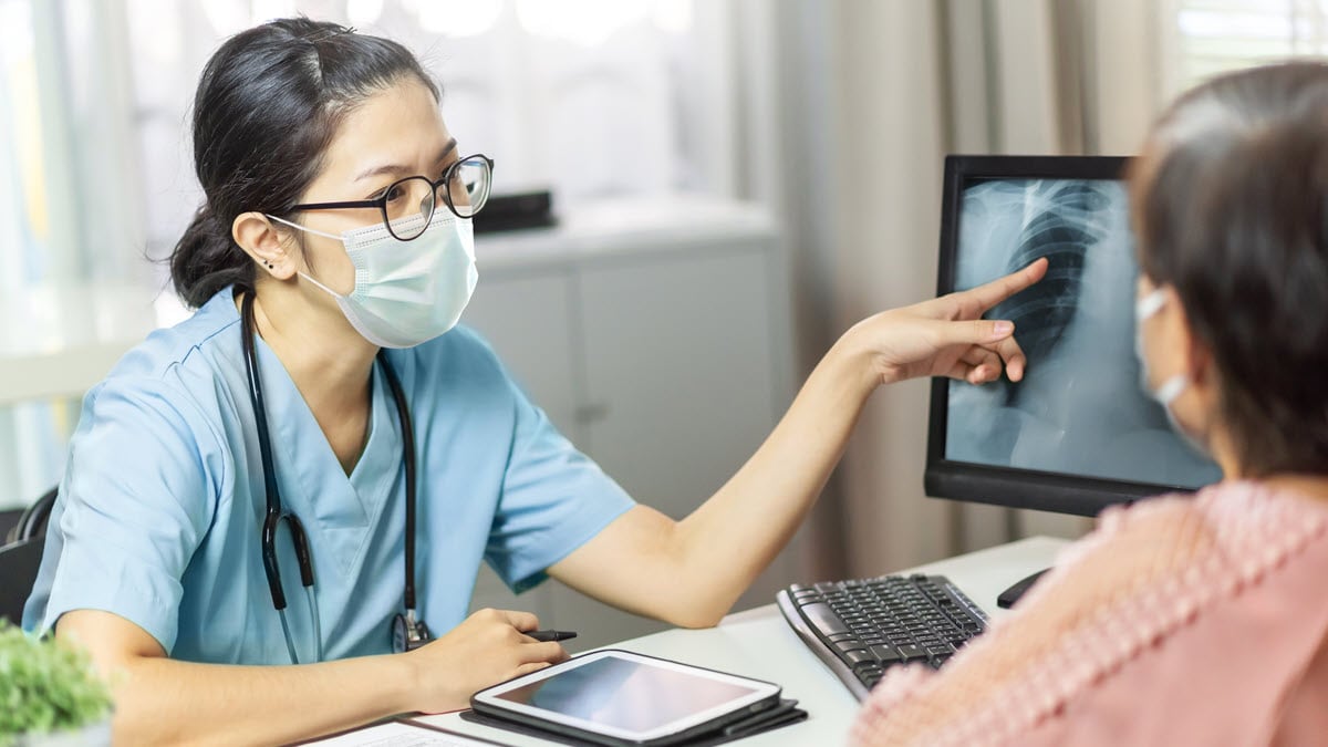 Health care provider reviewing xray with patient