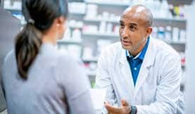 pharmacist helping patient