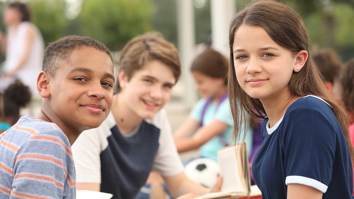 Group of smiling adolescents outdoors