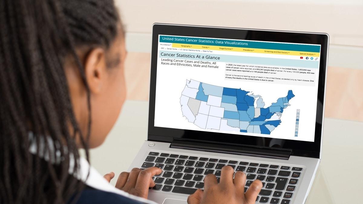 A woman looking at the Data Visualizations tool on her laptop