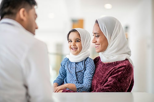 A mother and her daughter visiting a male health professional