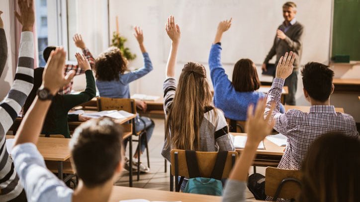 Teacher in class with students